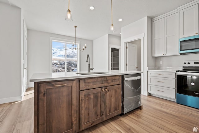 354 S 1150 E Unit 605, Smithfield, UT 84335 - kitchen with light wood-style flooring, a sink, appliances with stainless steel finishes, and light countertops