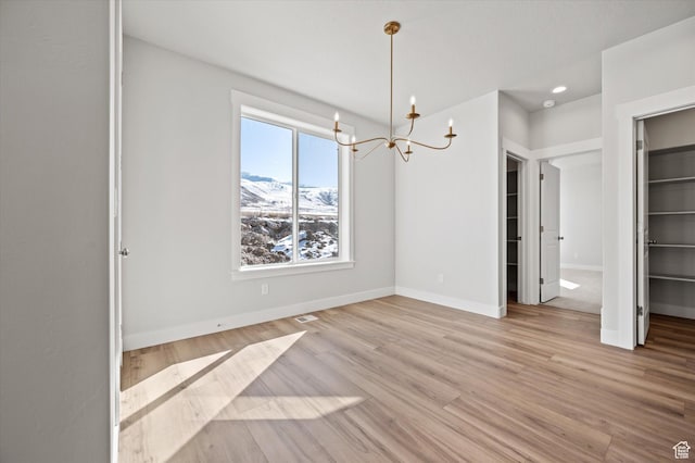 354 S 1150 E Unit 605, Smithfield, UT 84335 - unfurnished dining area with a chandelier, baseboards, light wood finished floors, and recessed lighting