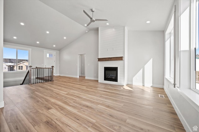 354 S 1150 E Unit 605, Smithfield, UT 84335 - unfurnished living room with lofted ceiling, light wood-style flooring, visible vents, ceiling fan, and recessed lighting