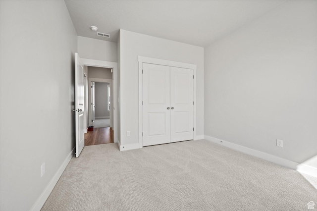 354 S 1150 E Unit 605, Smithfield, UT 84335 - unfurnished bedroom featuring baseboards, visible vents, carpet floors, and a closet