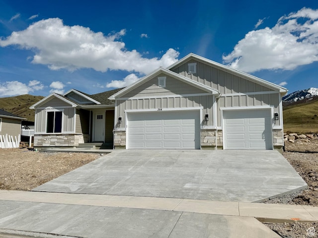 354 S 1150 E Unit 605, Smithfield, UT 84335 - craftsman house with concrete driveway, board and batten siding, an attached garage, and stone siding