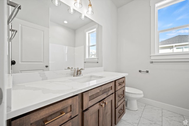 354 S 1150 E Unit 605, Smithfield, UT 84335 - full bathroom featuring vanity, toilet, marble finish floor, baseboards, and walk in shower