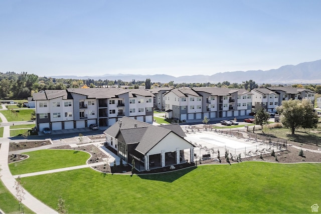 birds eye view of property featuring a mountain view