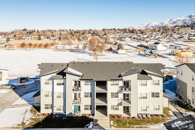 birds eye view of property with a mountain view