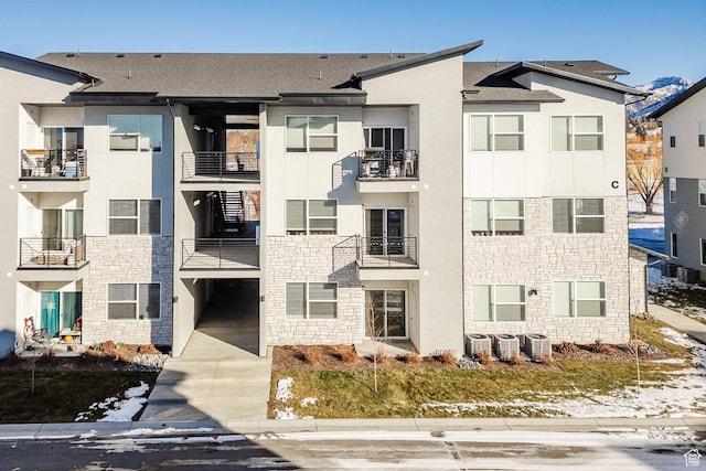 view of building exterior featuring central AC unit