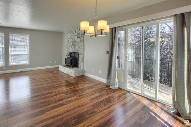 4698 Porter Ave, South Ogden, UT 84403 - unfurnished living room with dark hardwood / wood-style floors and a notable chandelier