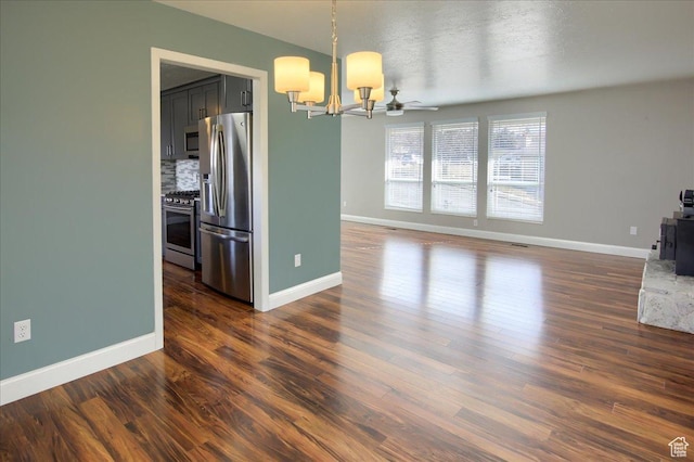 4698 Porter Ave, South Ogden, UT 84403 - unfurnished dining area featuring a textured ceiling, dark hardwood / wood-style flooring, and a notable chandelier