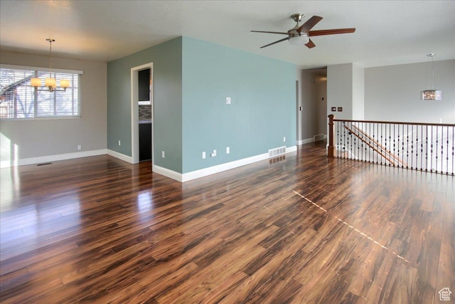 4698 Porter Ave, South Ogden, UT 84403 - empty room with ceiling fan with notable chandelier and dark wood-type flooring
