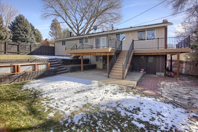 4698 Porter Ave, South Ogden, UT 84403 - snow covered rear of property with a deck