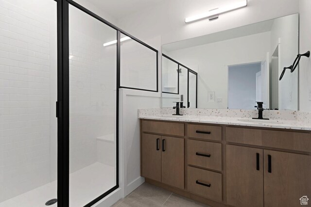 7091 W S Jordan Pkwy Unit 394, South Jordan, UT 84009 - full bathroom featuring a stall shower, double vanity, and tile patterned flooring