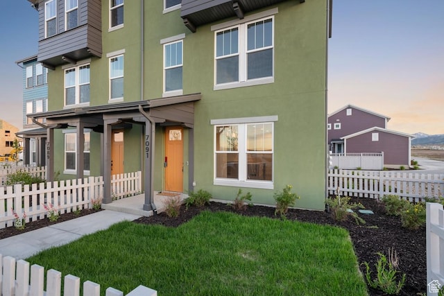7091 W S Jordan Pkwy Unit 394, South Jordan, UT 84009 - view of front facade featuring stucco siding
