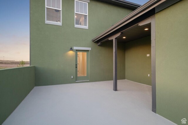 7091 W S Jordan Pkwy Unit 394, South Jordan, UT 84009 - back of property with stucco siding and a patio area