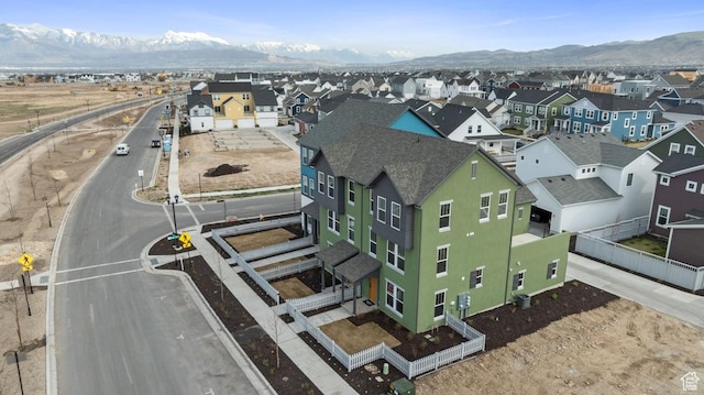 aerial perspective of suburban area with a mountainous background