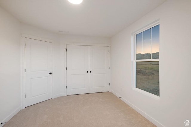 7091 W S Jordan Pkwy Unit 394, South Jordan, UT 84009 - unfurnished bedroom with carpet floors, baseboards, and a closet