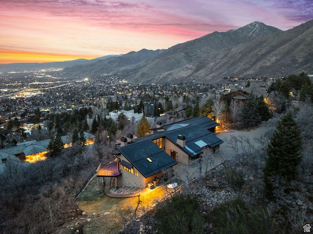 4552 S Zarahemla Dr E, Salt Lake City, UT 84124 - aerial view at dusk featuring a mountain view