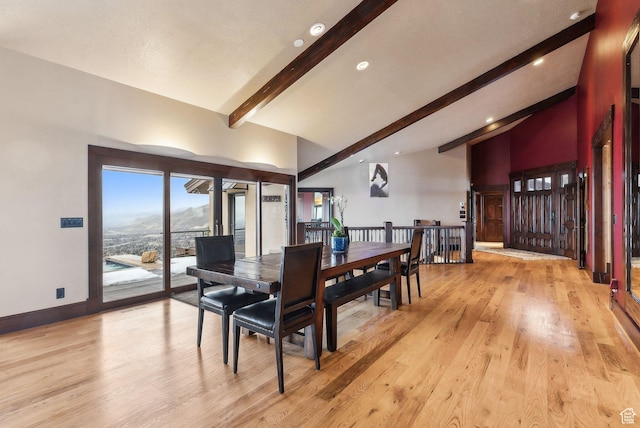 4552 S Zarahemla Dr E, Salt Lake City, UT 84124 - dining room with high vaulted ceiling, light wood-style floors, baseboards, and beam ceiling