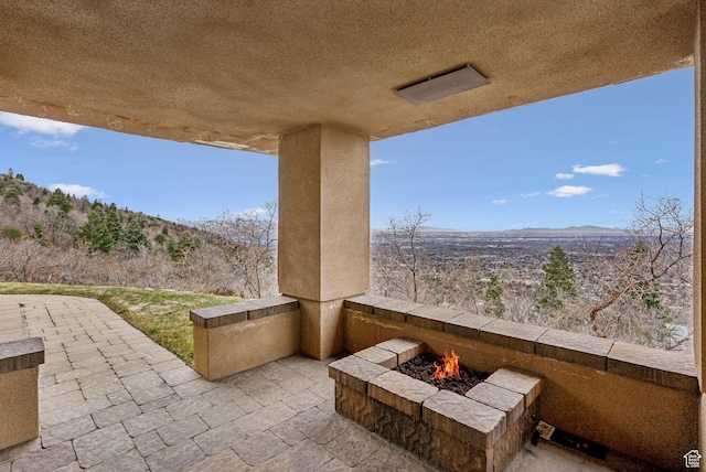 4552 S Zarahemla Dr E, Salt Lake City, UT 84124 - view of patio with a fire pit and a mountain view