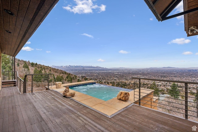 4552 S Zarahemla Dr E, Salt Lake City, UT 84124 - view of swimming pool with a jacuzzi and a mountain view