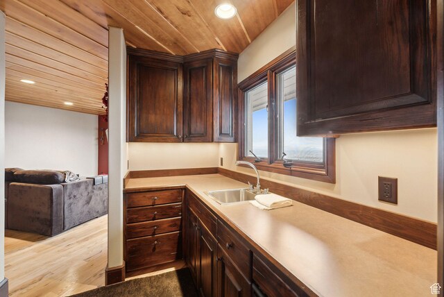 4552 S Zarahemla Dr E, Salt Lake City, UT 84124 - kitchen featuring a sink, dark brown cabinets, light countertops, and wooden ceiling