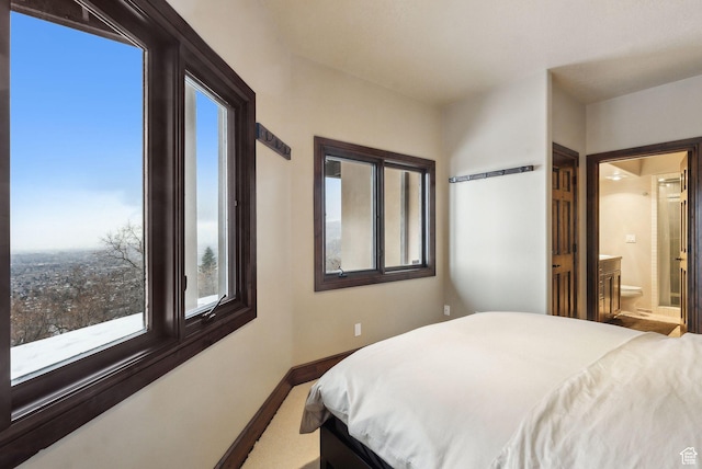 4552 S Zarahemla Dr E, Salt Lake City, UT 84124 - bedroom with carpet flooring, ensuite bath, and baseboards