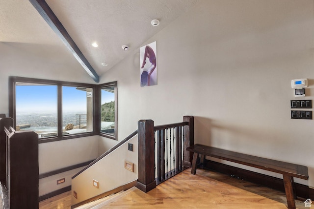 4552 S Zarahemla Dr E, Salt Lake City, UT 84124 - staircase with baseboards, a textured ceiling, wood finished floors, and lofted ceiling