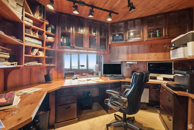 4552 S Zarahemla Dr E, Salt Lake City, UT 84124 - office space with built in desk, wood walls, wooden ceiling, and light tile patterned flooring