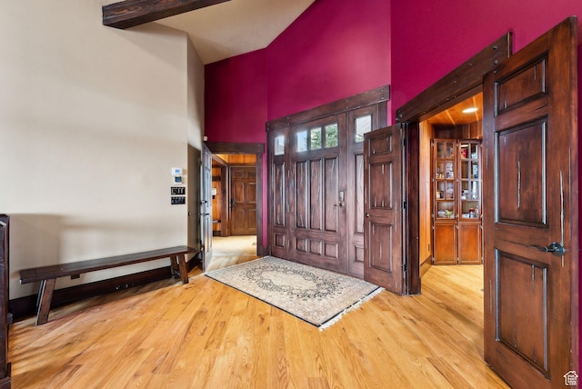 4552 S Zarahemla Dr E, Salt Lake City, UT 84124 - entryway with a high ceiling, beamed ceiling, and wood finished floors