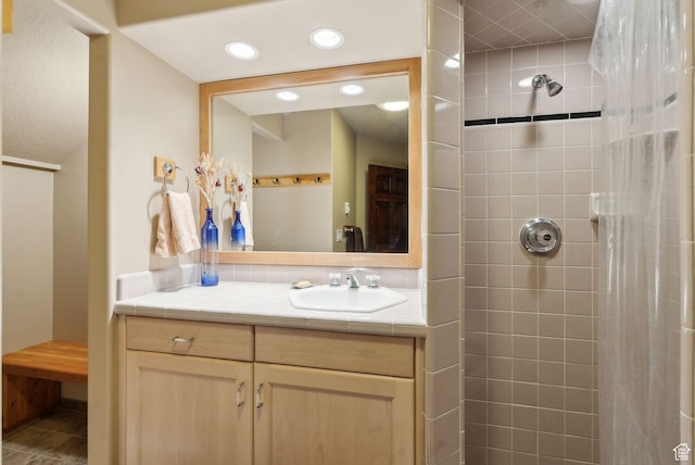 4552 S Zarahemla Dr E, Salt Lake City, UT 84124 - bathroom with tiled shower, vanity, and recessed lighting