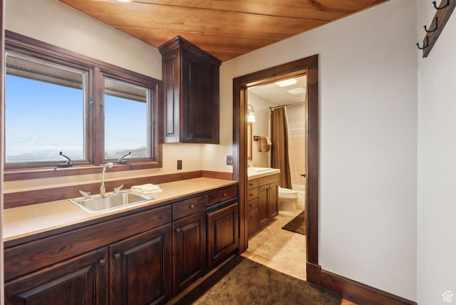 4552 S Zarahemla Dr E, Salt Lake City, UT 84124 - kitchen featuring wooden ceiling, light countertops, a sink, and dark brown cabinets