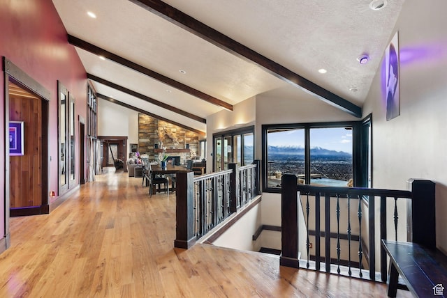 4552 S Zarahemla Dr E, Salt Lake City, UT 84124 - corridor with a textured ceiling, wood finished floors, vaulted ceiling with beams, and an upstairs landing