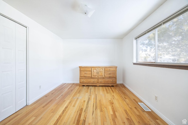 2243 N 1400 E, North Logan, UT 84341 - unfurnished bedroom featuring a closet and light hardwood / wood-style flooring
