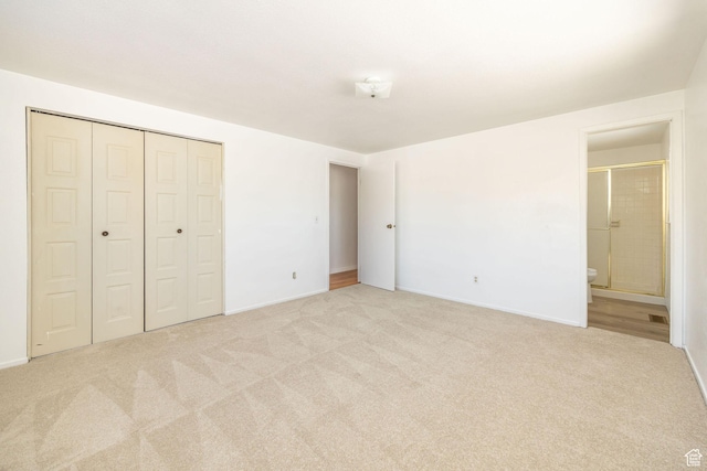 2243 N 1400 E, North Logan, UT 84341 - unfurnished bedroom featuring a closet, light colored carpet, and ensuite bath