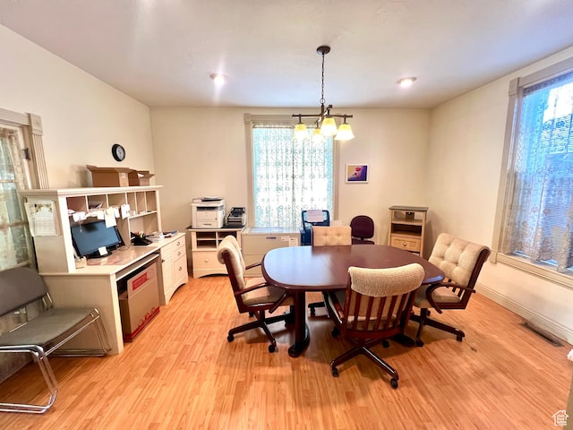 96 W 200 N, Richfield, UT 84701 - dining space featuring a notable chandelier and light wood-type flooring