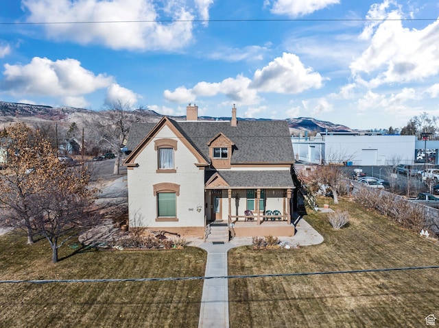 96 W 200 N, Richfield, UT 84701 - view of front of property with a porch, a mountain view, and a front lawn