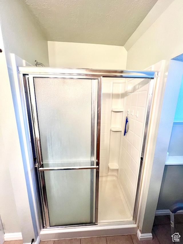 96 W 200 N, Richfield, UT 84701 - bathroom with a shower with door and a textured ceiling