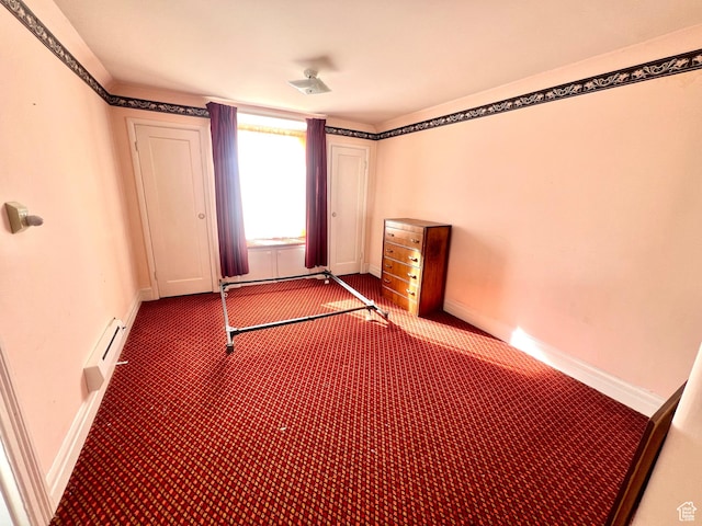 96 W 200 N, Richfield, UT 84701 - unfurnished bedroom with carpet floors and a baseboard heating unit