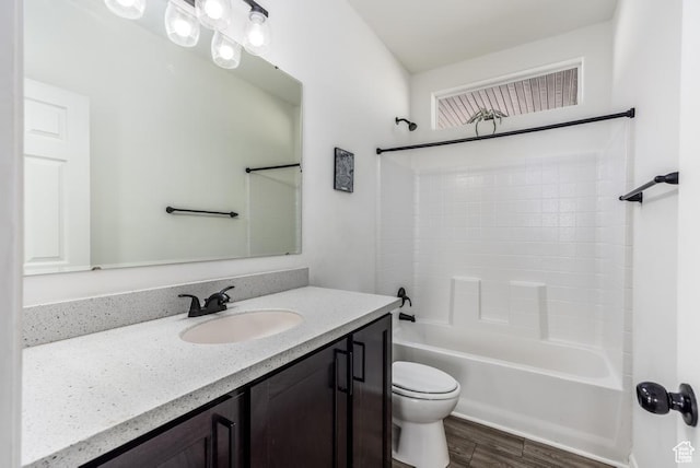 full bathroom featuring shower / bathtub combination, wood-type flooring, toilet, and vanity