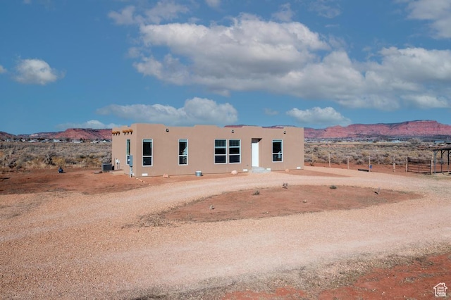 view of front of home featuring a mountain view