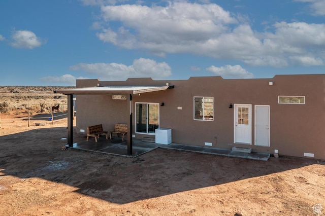 rear view of house featuring a patio area