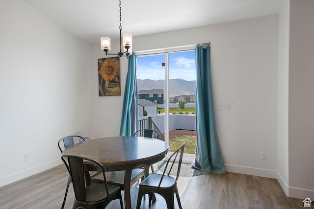 3492 N Delta St, Eagle Mountain, UT 84005 - dining area with a mountain view, hardwood / wood-style flooring, and a notable chandelier