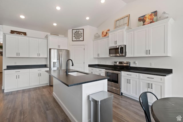 3492 N Delta St, Eagle Mountain, UT 84005 - kitchen with appliances with stainless steel finishes, lofted ceiling, white cabinetry, an island with sink, and sink