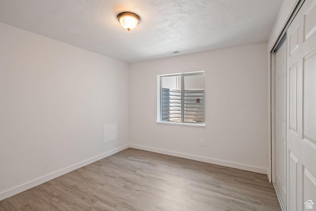 3492 N Delta St, Eagle Mountain, UT 84005 - unfurnished bedroom with a closet and light hardwood / wood-style floors