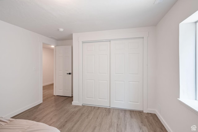 3492 N Delta St, Eagle Mountain, UT 84005 - unfurnished bedroom with light hardwood / wood-style flooring and a closet