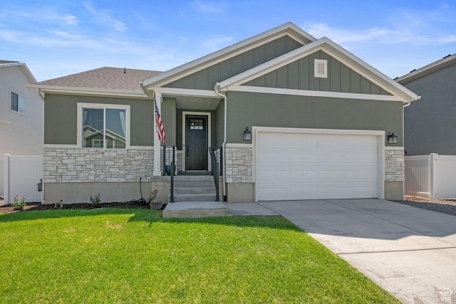 craftsman house with a garage and a front lawn