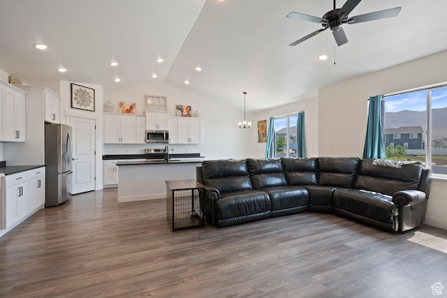 3492 N Delta St, Eagle Mountain, UT 84005 - living room with wood-type flooring, sink, ceiling fan with notable chandelier, and lofted ceiling