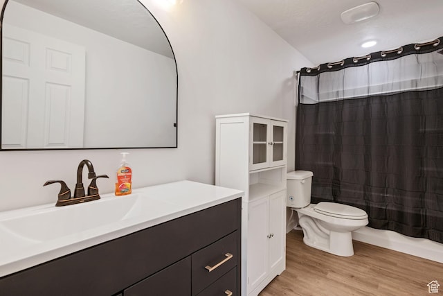 3492 N Delta St, Eagle Mountain, UT 84005 - full bathroom featuring hardwood / wood-style floors, toilet, shower / bath combination with curtain, and vanity