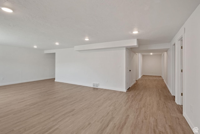 3492 N Delta St, Eagle Mountain, UT 84005 - unfurnished room with light hardwood / wood-style floors and a textured ceiling