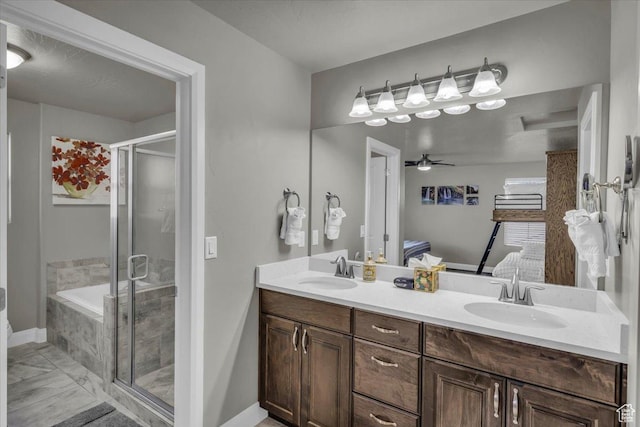 bathroom featuring vanity, ceiling fan, and separate shower and tub