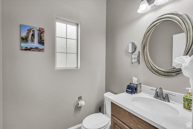 bathroom with toilet and vanity