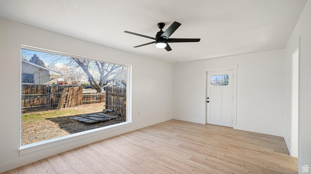 spare room featuring ceiling fan and light hardwood / wood-style floors